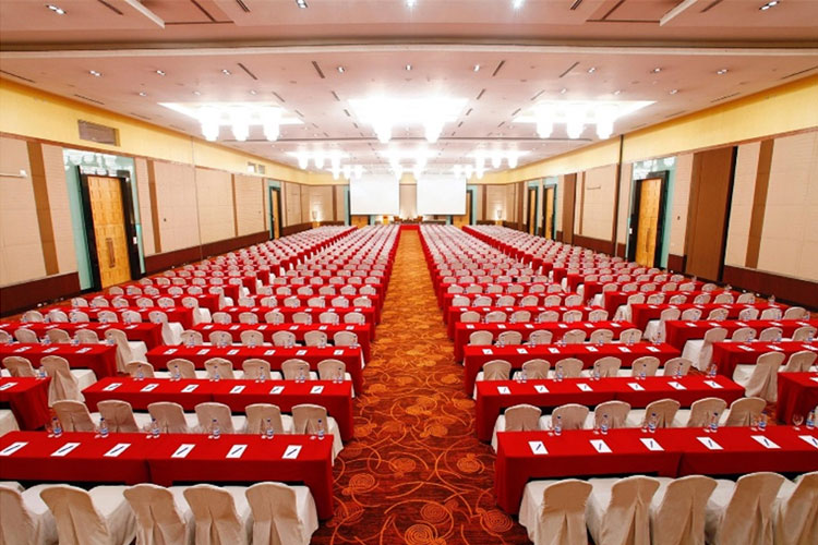 Ballroom in classroom set-up facing twin projection screens